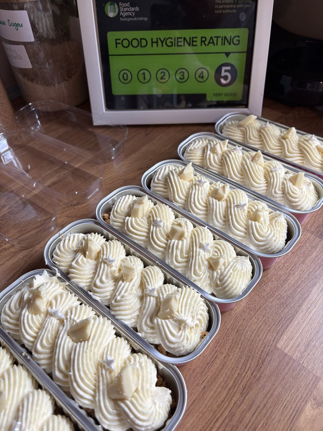 Individual vanilla cheesecake pots with white chocolate shavings