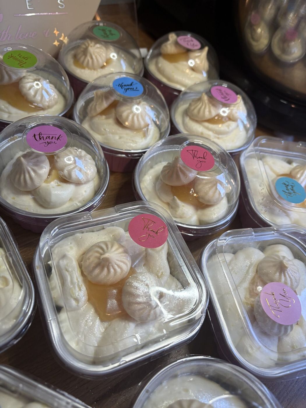 Individual lemon meringue dessert pots with mini meringue kisses